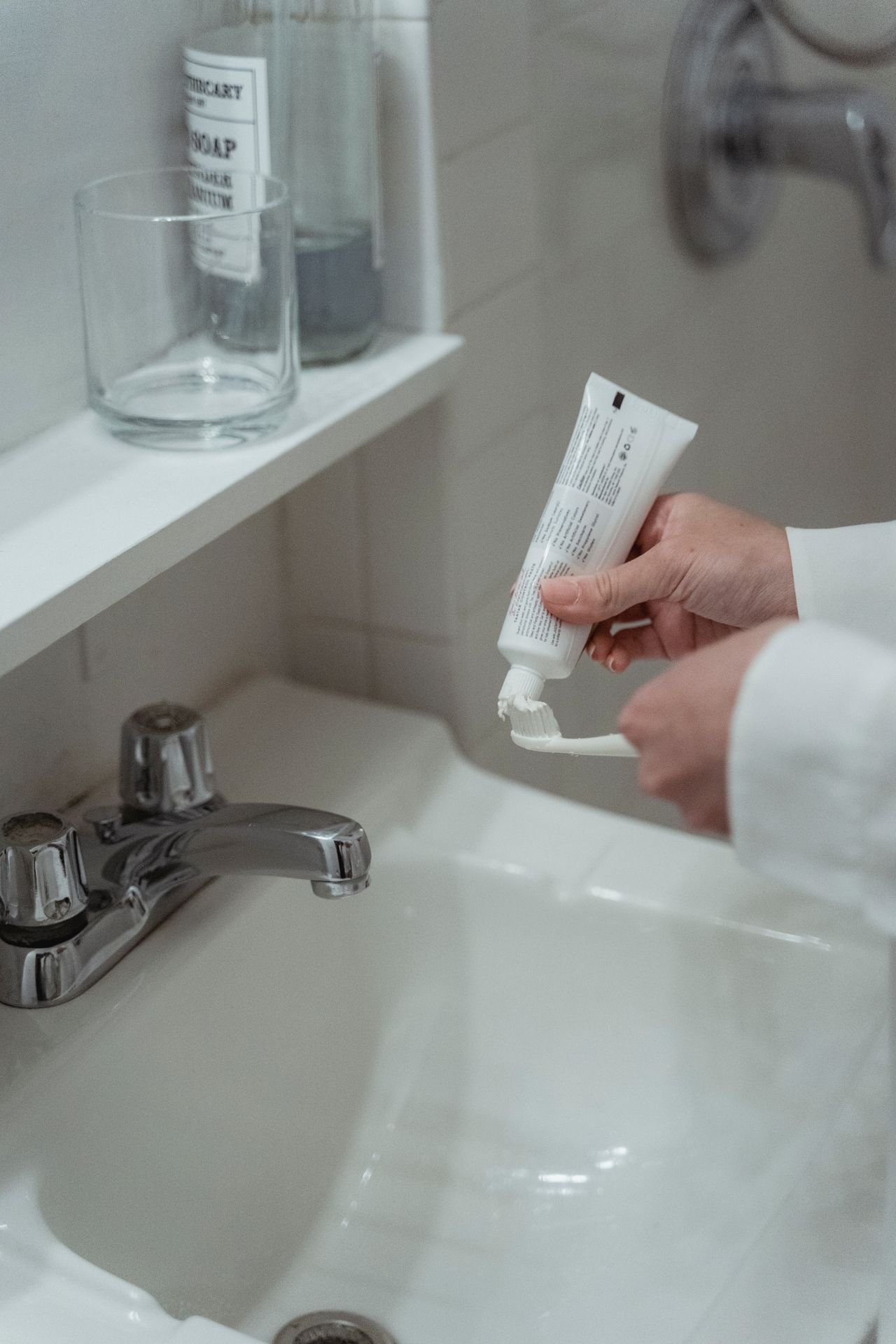 Close-up of a person brushing teeth with toothpaste